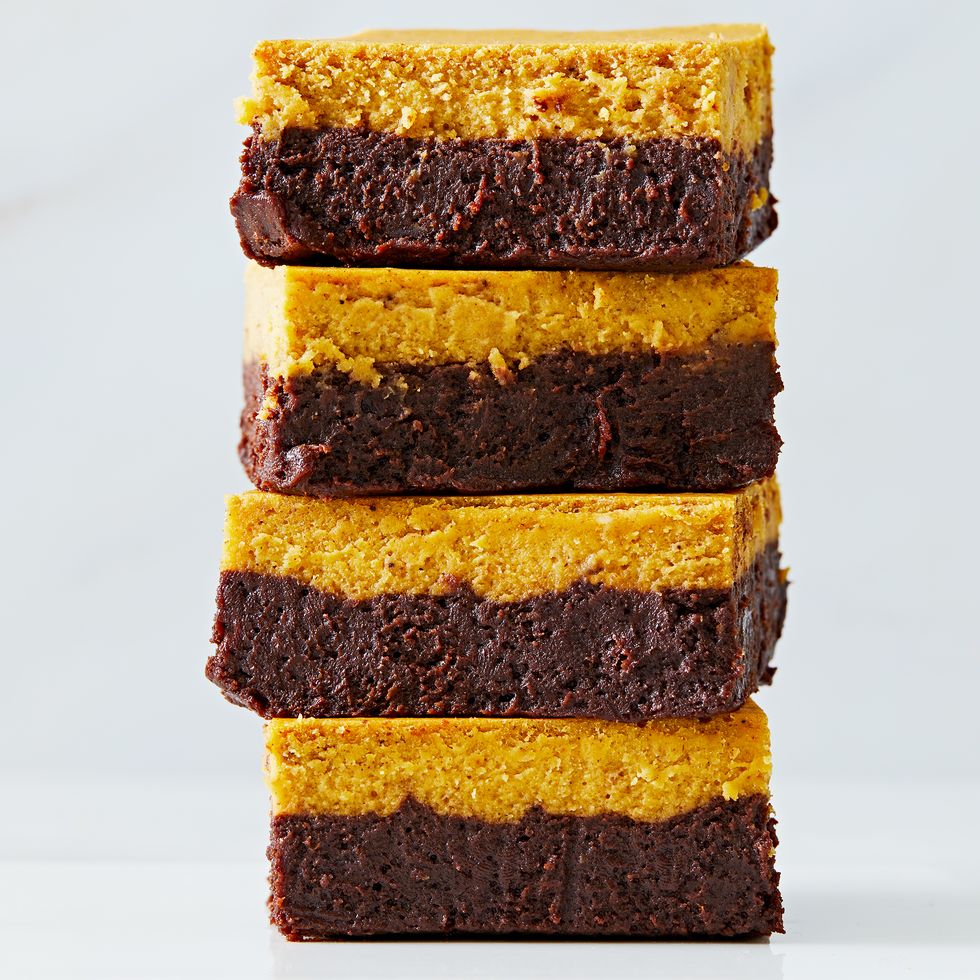 brownies with a chocolate layer and pumpkin cheesecake layer