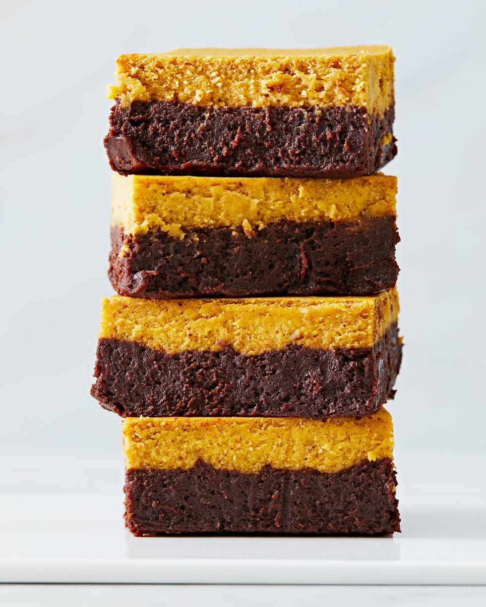 brownies with a chocolate layer and pumpkin cheesecake layer