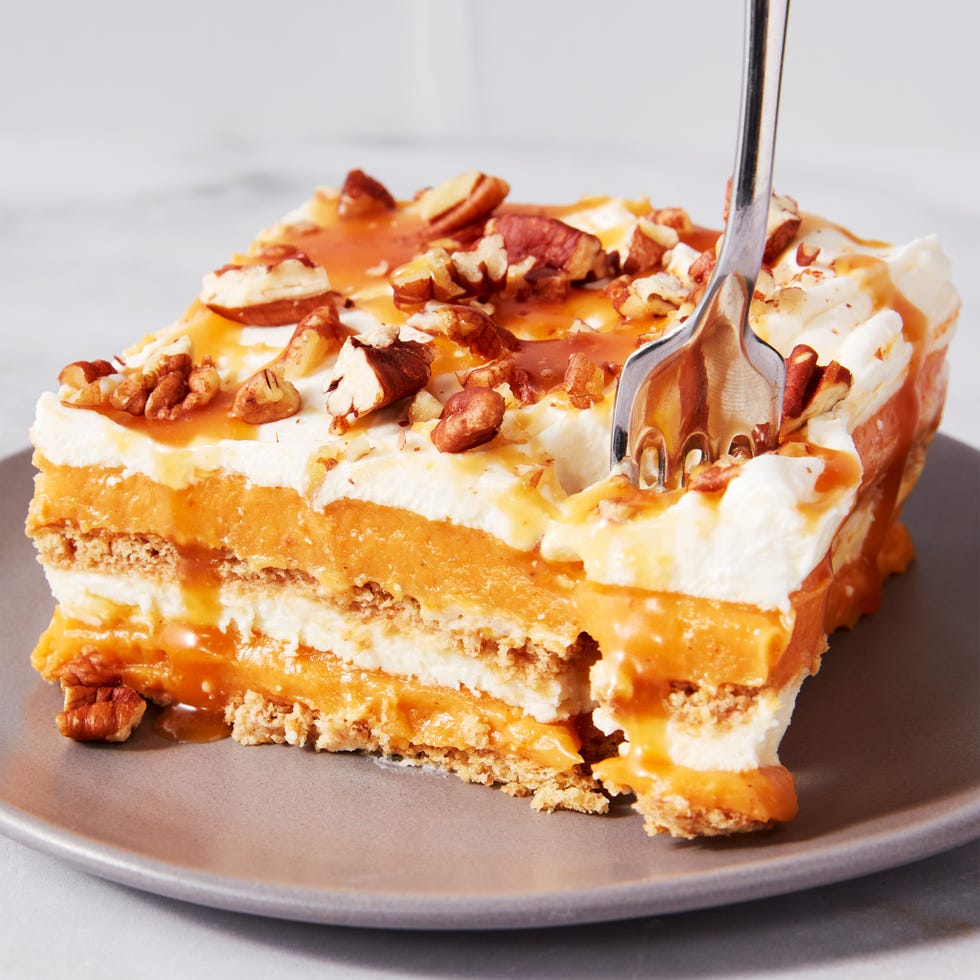 pumpkin cheesecake lasagna topped with pecans and caramel