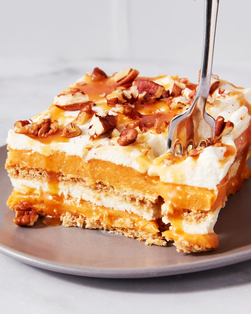pumpkin cheesecake lasagna topped with pecans and caramel