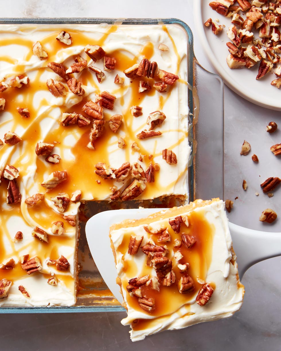 pumpkin cheesecake lasagna topped with pecans and caramel