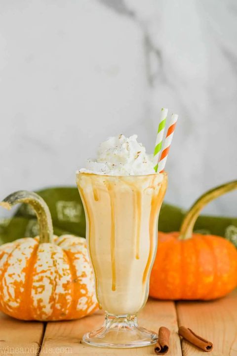 boozy pumpkin milkshakes with two straws