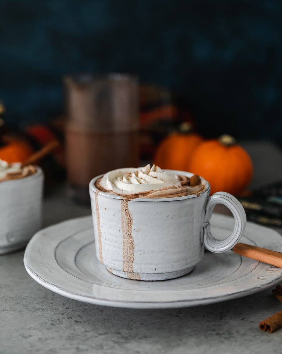 boozy pumpkin pie hot chocolate in mug with whipped cream