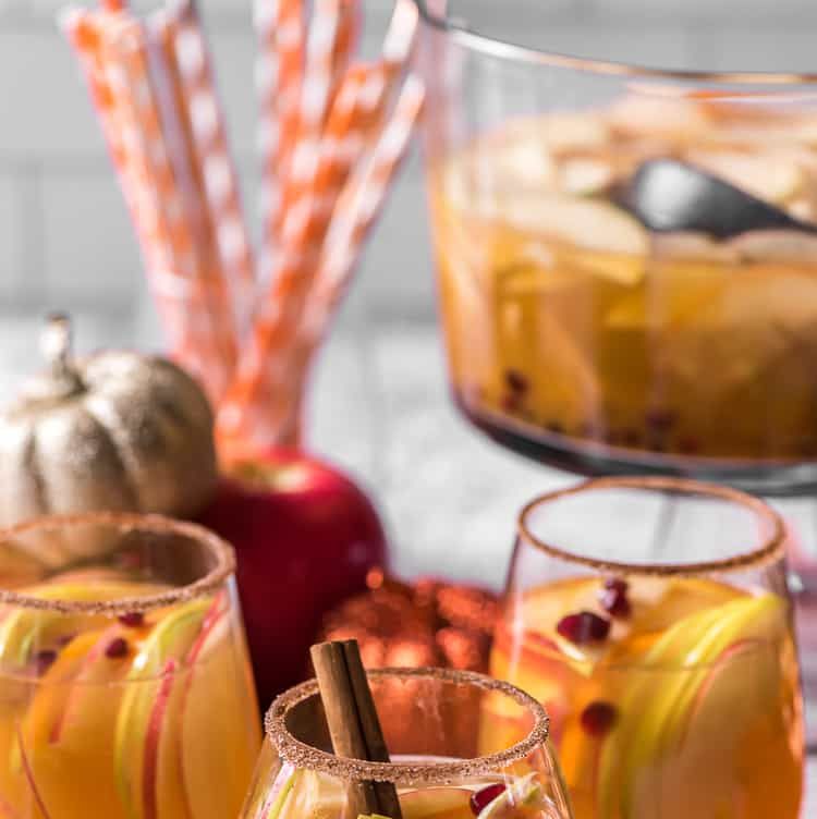 pumpkin party punch with pomegranate seeds and apple slices