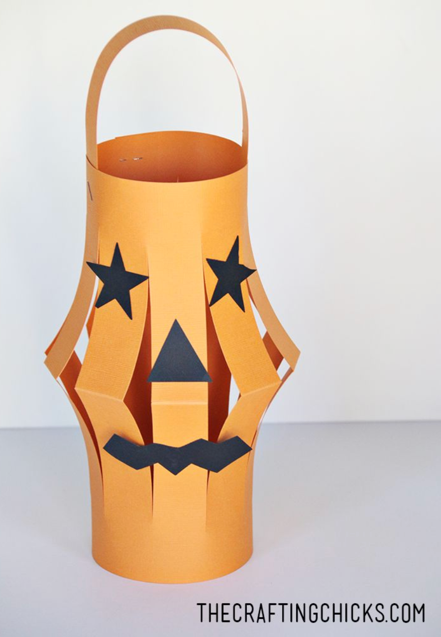 An orange paper lantern crafted to look like a pumpkin an orange paper lantern crafted to look like a pumpkin