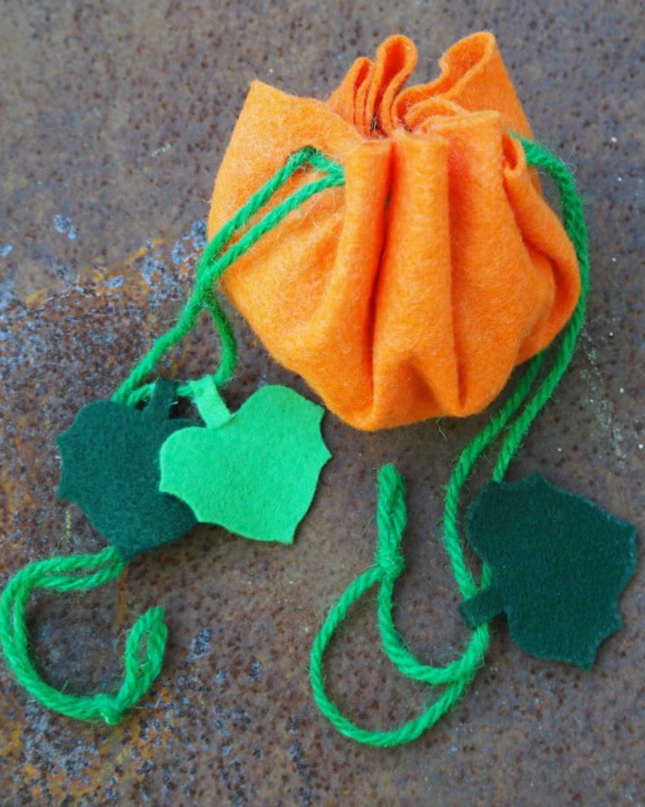 Pumpkin shaped treat bag made from orange and greenfelt and string pumpkin shaped treat bag made from orange and greenfelt and string