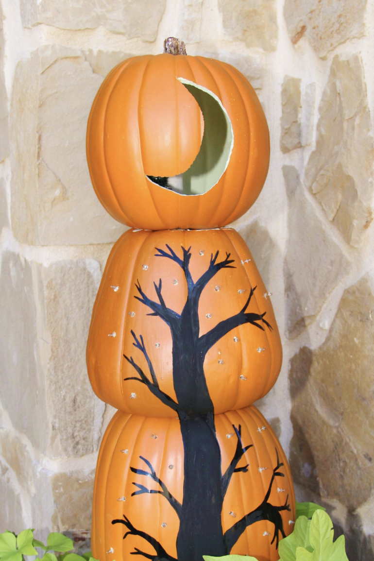 pumpkin carving ideas, three pumpkins stacked on top of each other, with a drawn on tree and moon carving