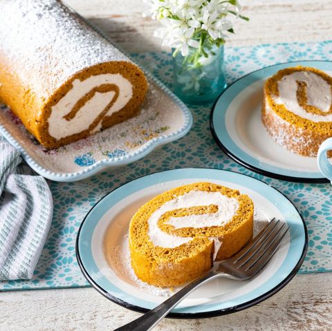 pumpkin roll with slice on plate and fork