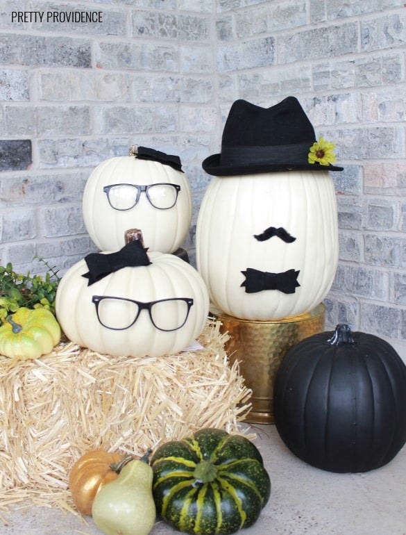 pumpkin faces, three white pumpkins with glasses and faux mustaches
