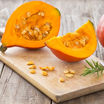 Sliced hokkaido pumpkin on a wooden board Sliced hokkaido pumpkin on a wooden board