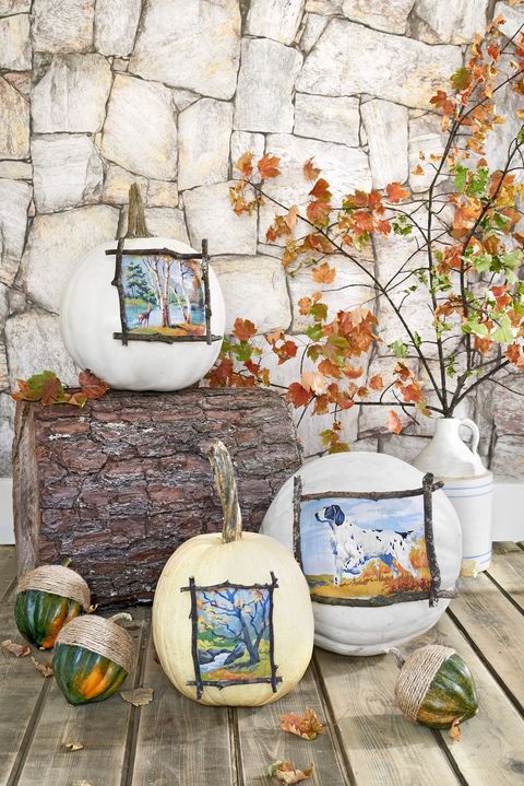 pumpkins decoupaged with paint by number scenes, displayed with acorn squash with twine wrapped tops to look like acorns