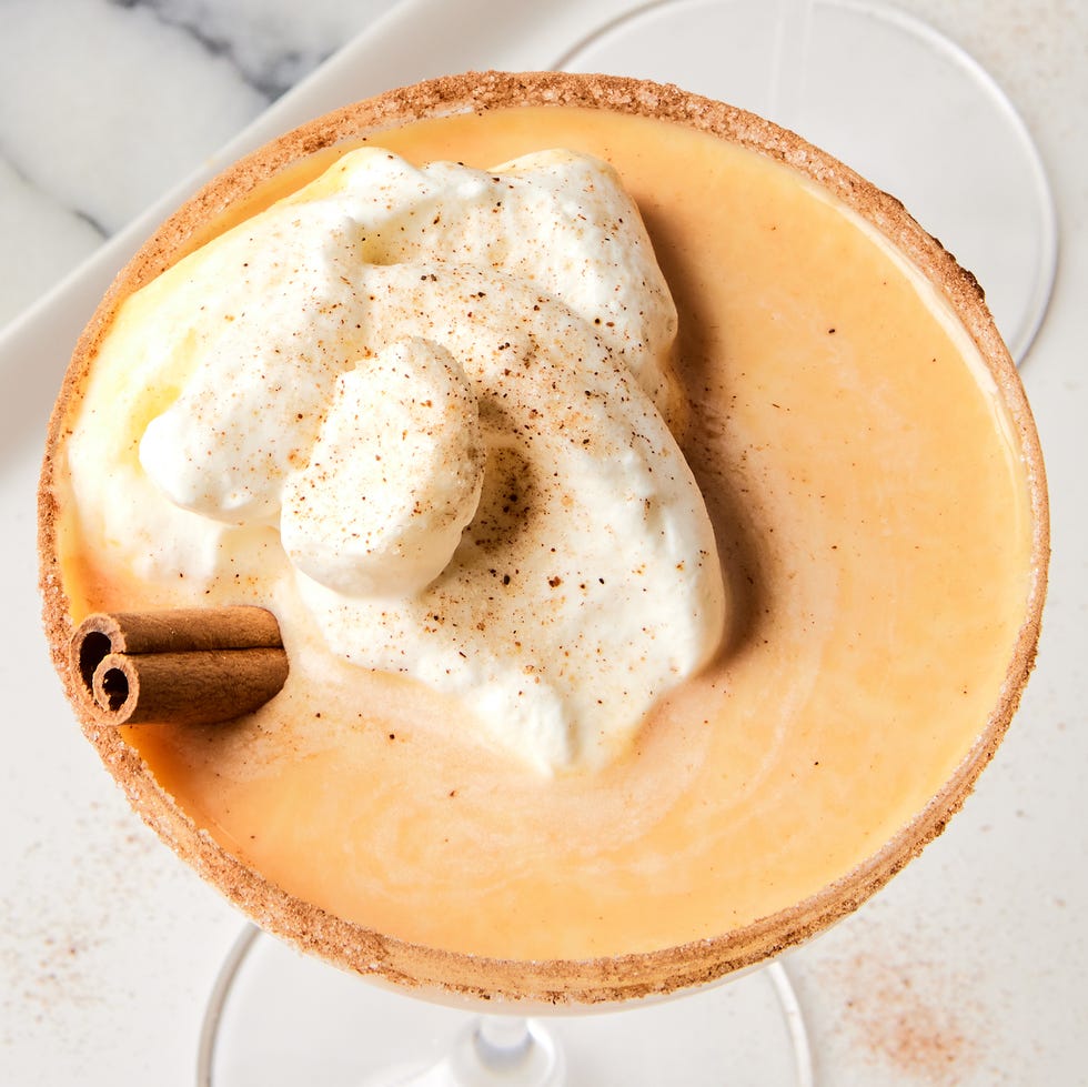 pumpkin pie martini with whipped cream and cinnamon