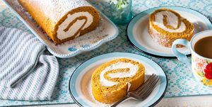 pumpkin roll recipe with cream cheese filling dusted with powdered sugar