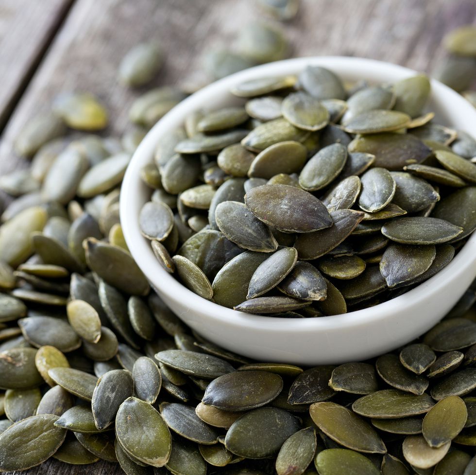 pumpkin seeds on wooden surface