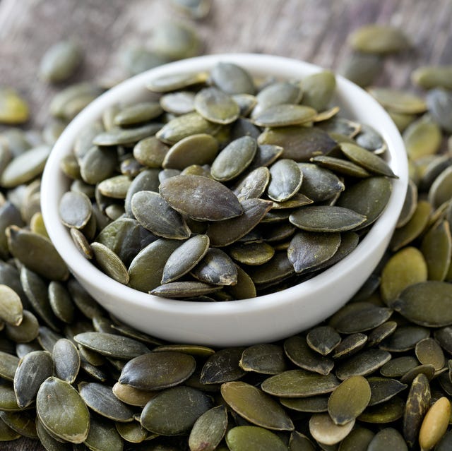 pumpkin seeds on wooden surface