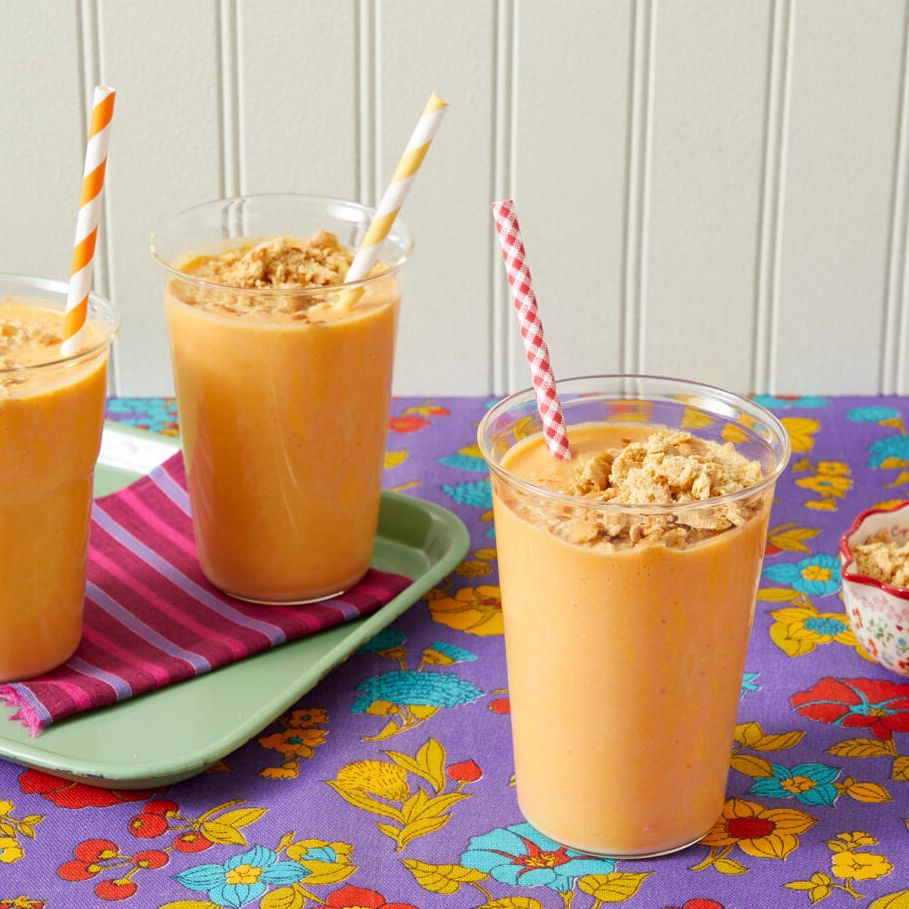 pumpkin smoothie recipe with crushed graham crackers on purple flower surface