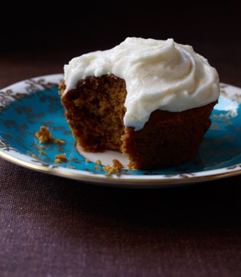 pumpkin spice cupcakes with orange sour cream frosting