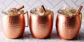 pumpkin spice mules with cinnamon garnish in a mule mug