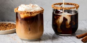pumpkin spice white russians with cinnamon and whipped cream