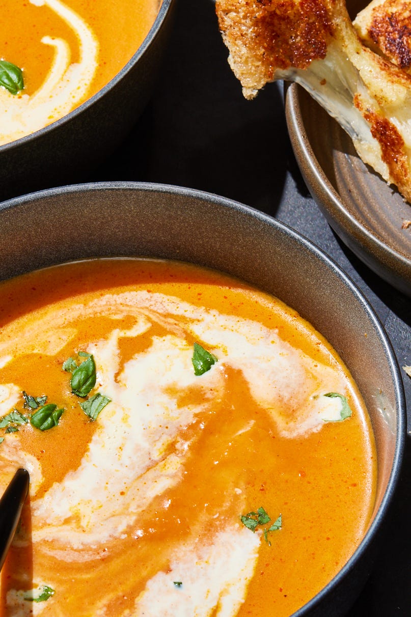 Pumpkin Tomato Soup with Grilled Cheese Sticks pumpkin tomato soup with cream and herbs served with grilled cheese sticks