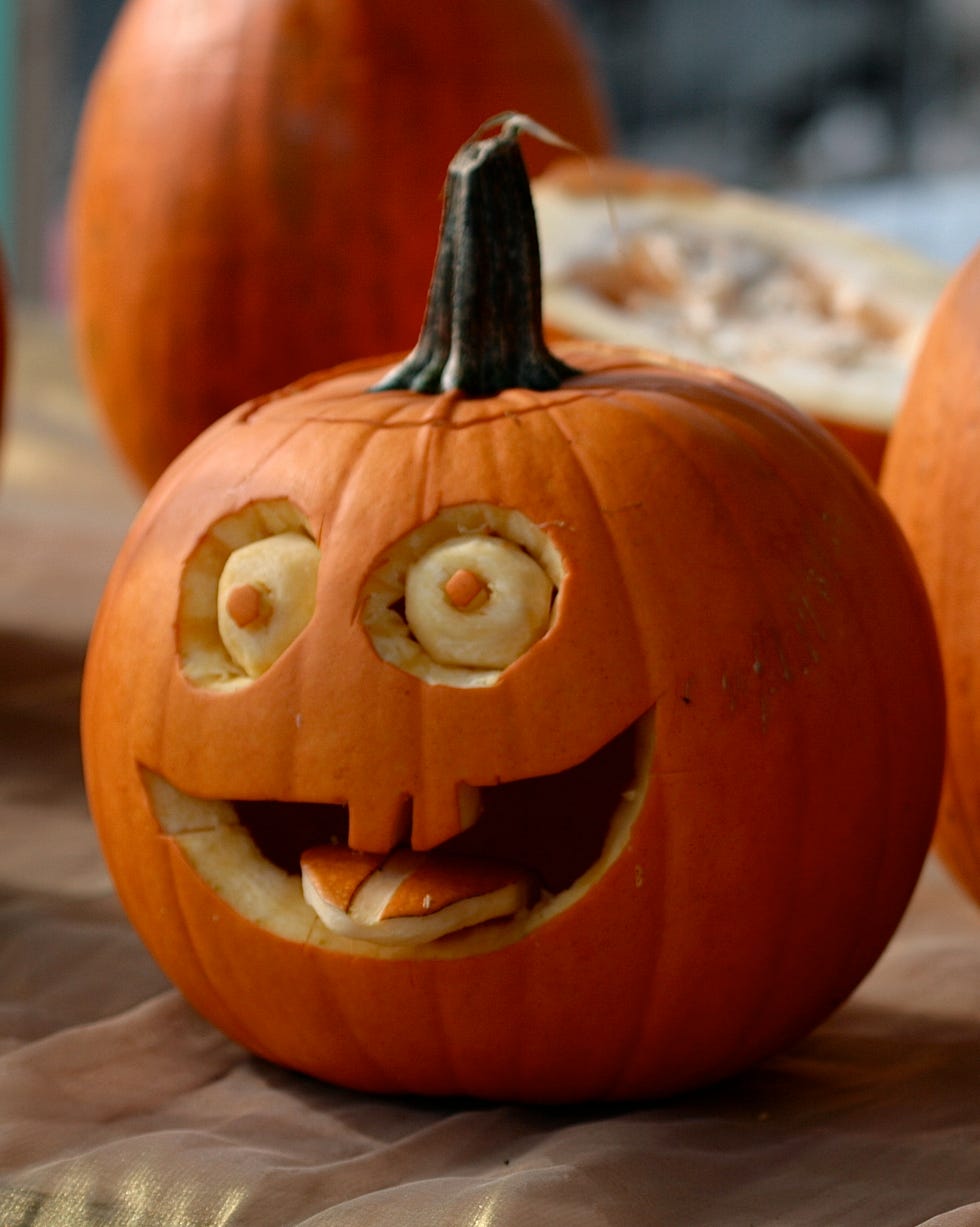 pumpkins decorated with faces with eyes and mouths