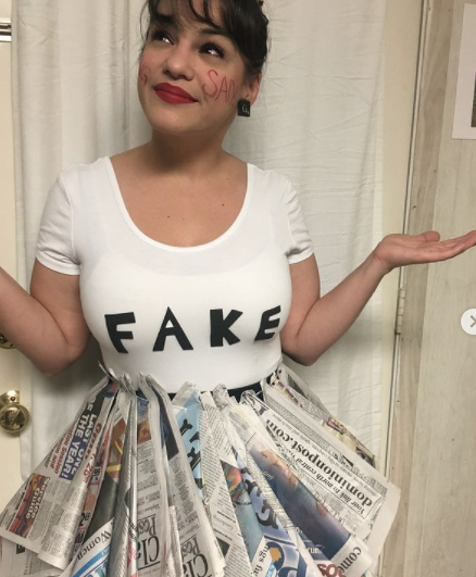 woman wearing fake news costume