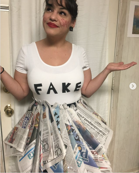 woman wearing fake news costume