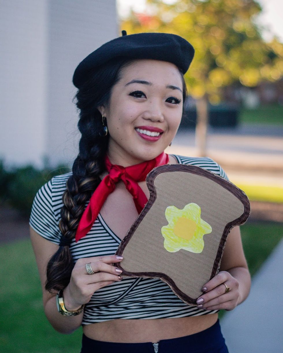 french toast pun costume with faux toast accessory, black and white stripe top, red neckerchief, and black beret