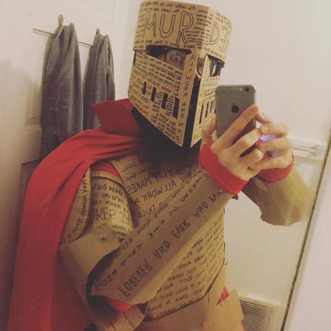pun halloween costume with cardboard suit of armor with phrases from the shining written all over it