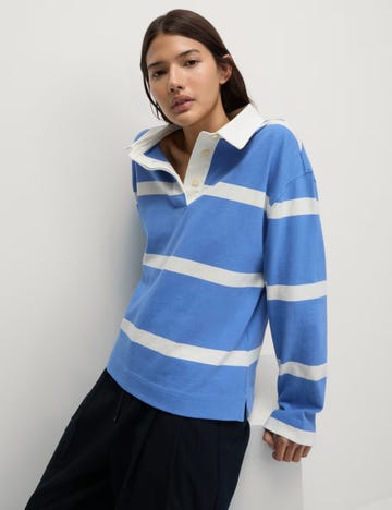 model wearing a blue striped polo shirt