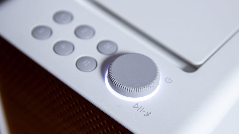 control panel of a device with a dial and buttons