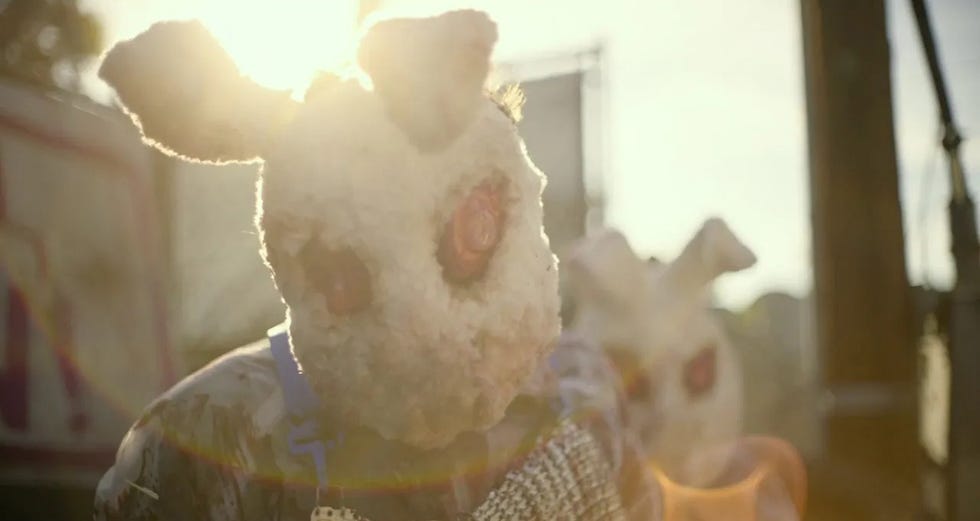 a person wears a menacing bunny mask in a scene from the forever purge, the sixth film if you want to watch the purge movies in order
