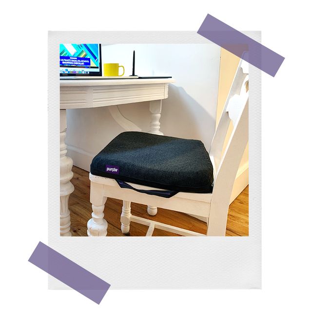 purple royal cushion on wooden chair at kitchen table
