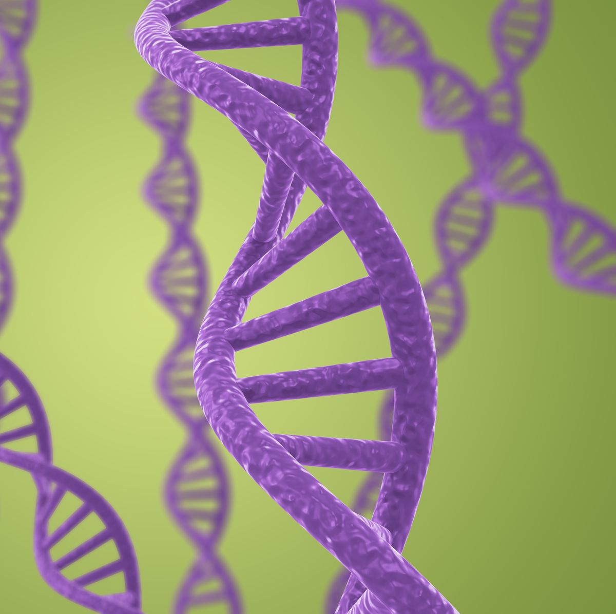 purple dna helices on a green background with shallow dof