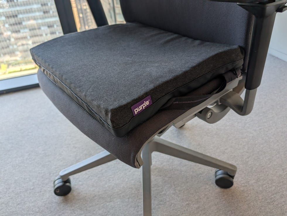 purple double seat cushion with a black zipped cover