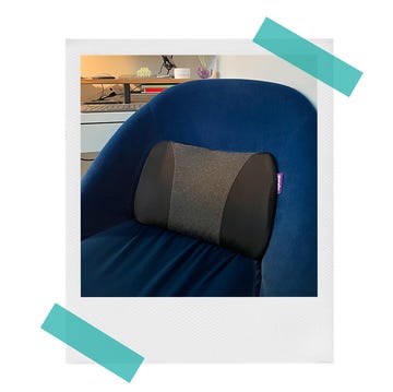 purple lumbar pillow on blue velvet desk chair