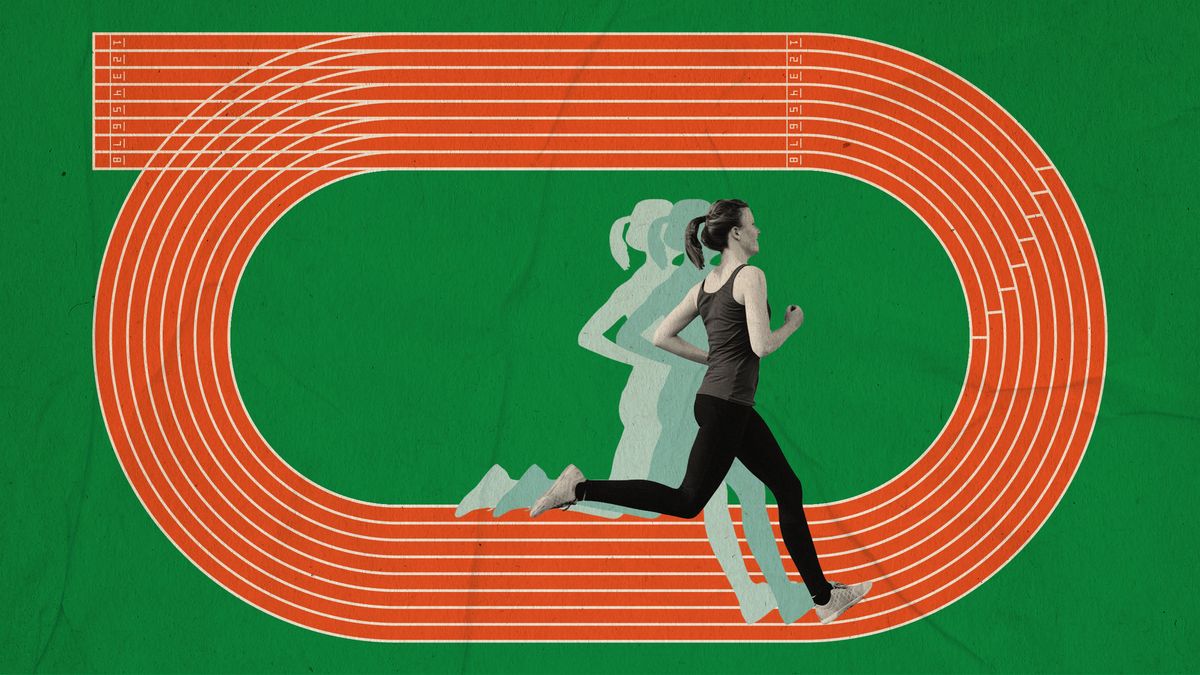woman running around a track