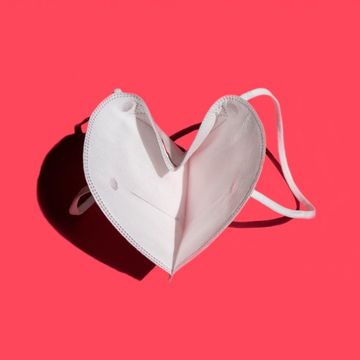 white medical mask on a red background