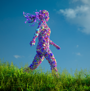 woman made of flowers walking through grass with blue sky