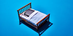iphone sleeping in a bed screen time digital detox sleep health
