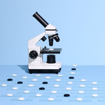 microscope with more white slides to look at than black slides