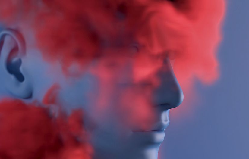 a face emerging from a red mist