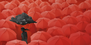 gray woman with gray cloud in sea of red umbrellas