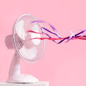 2at0ra0 electric fan with fluttering ribbons on color background menopause