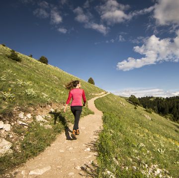 woman walking on hill path, nature, hiking