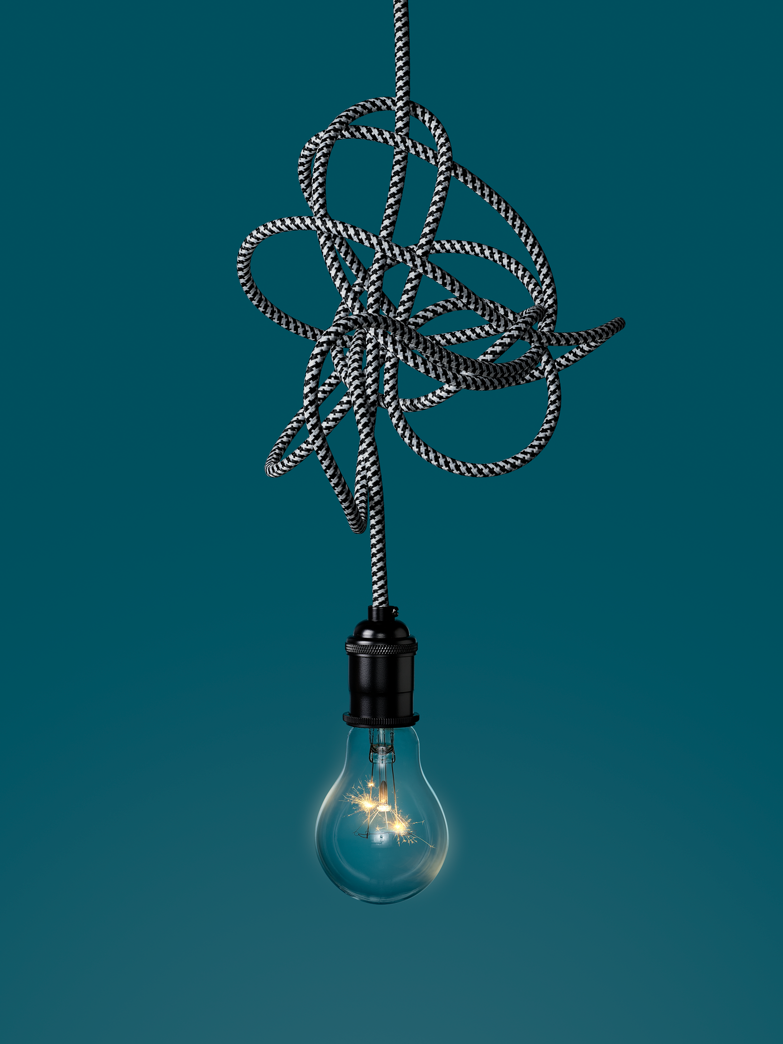 light bulb hanging from tangled wire