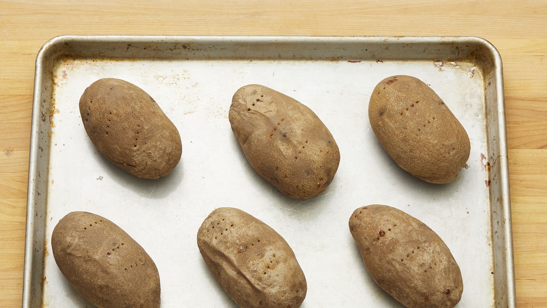 EASY Baked Potatoes in Oven (Crispy Skin & Fluffy Potatoes!)