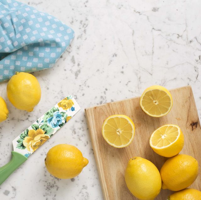 lemons on cutting board with floral knife