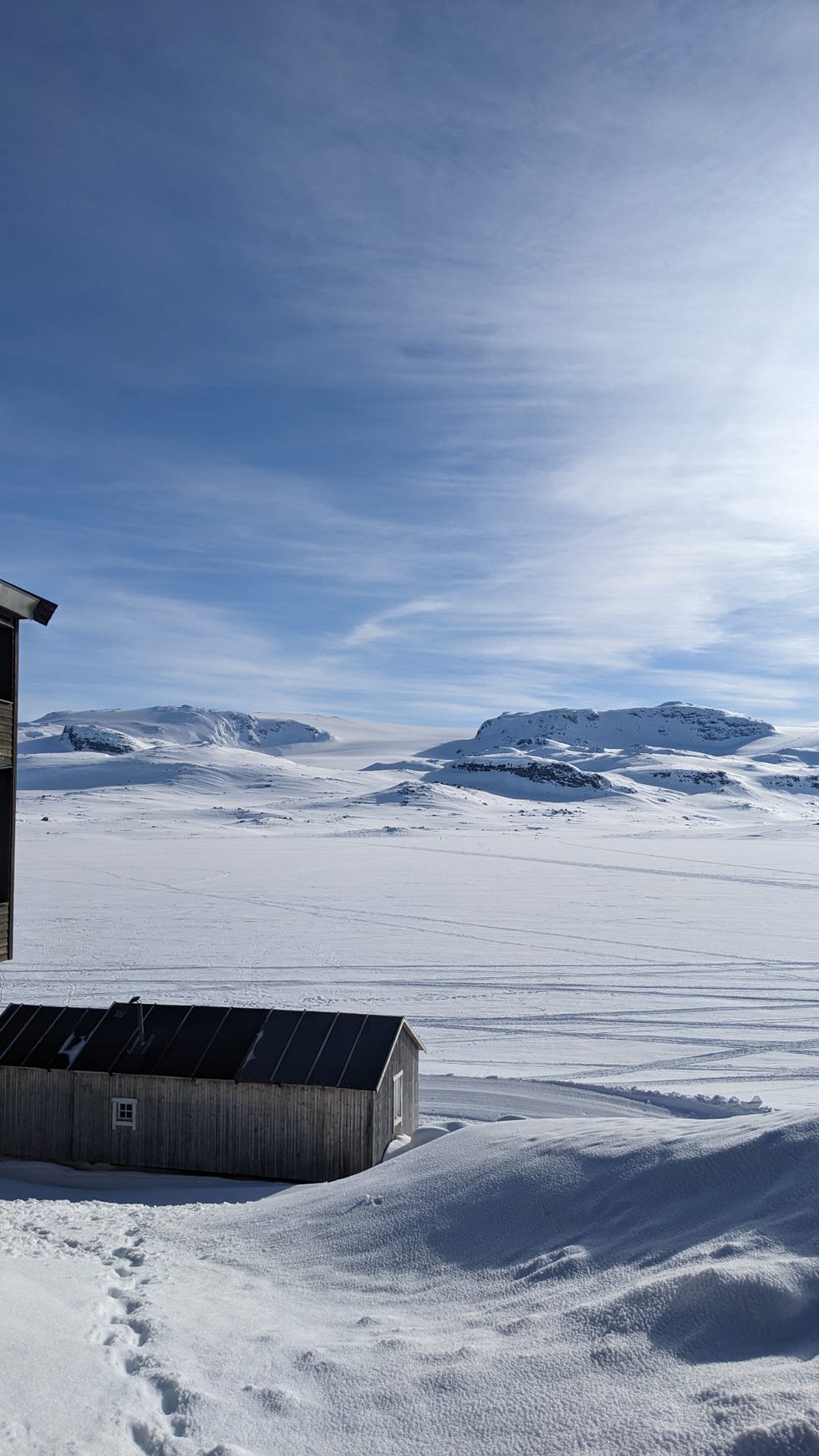 a snowy landscape with a building