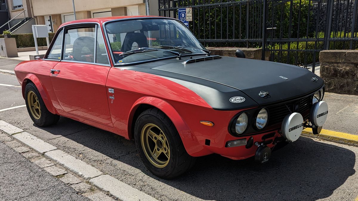 lancia fulvia 13s coupe parked on street in luxembourg